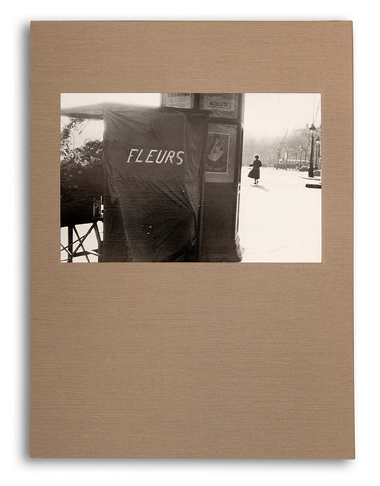 Robert Frank's Flower Is consists of three bodies of work. It begins with photographs taken in Paris of flowers, flower sellers, and chance encounters on the street, continues in a car factory in Detroit, and ends with polaroids made in Mabou Mines, Nova Scotia.
