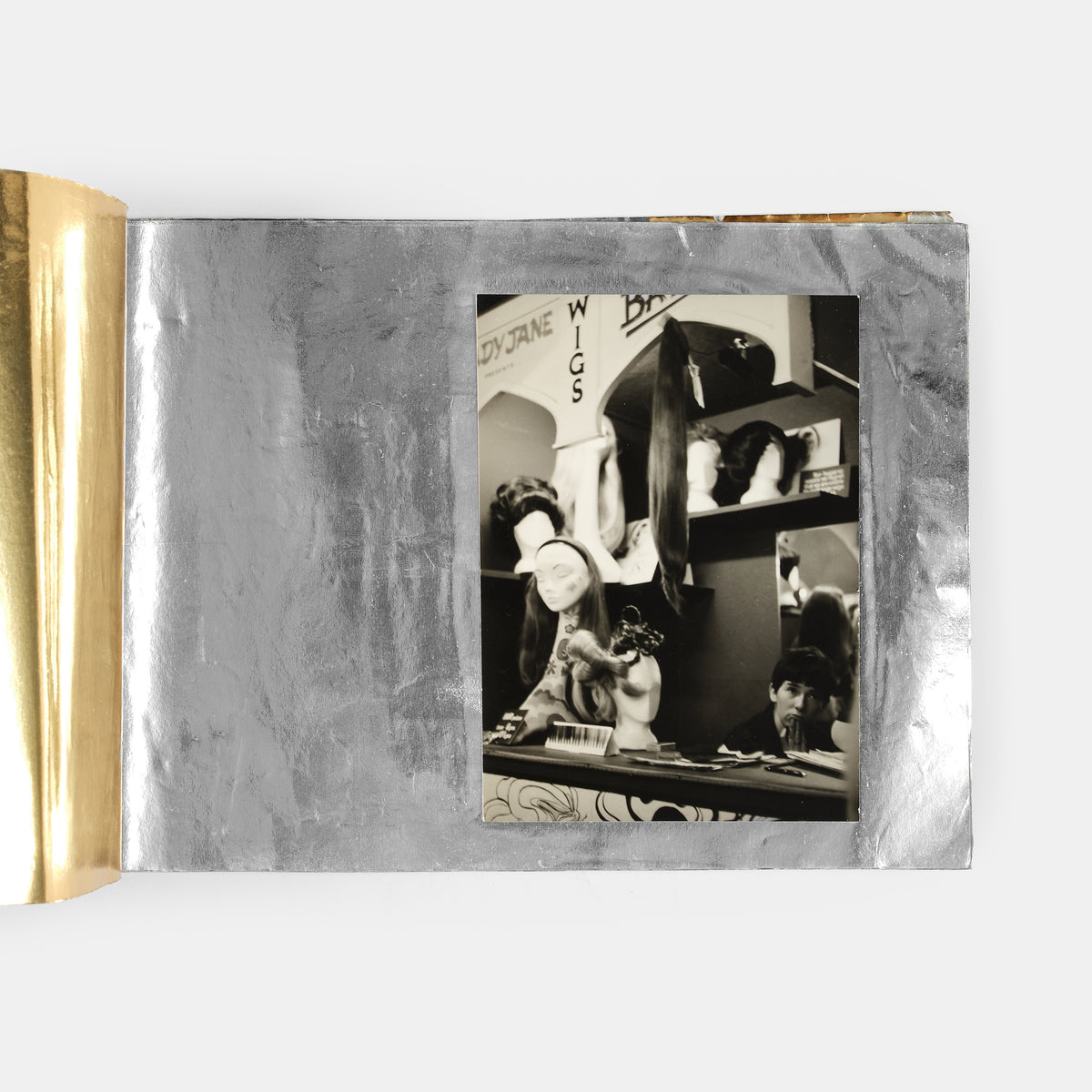 These photographs show the interior and exterior of the I Was Lord Kitchener's Valet boutique on Portobello Road and an anti-apartheid rally in November 1966.