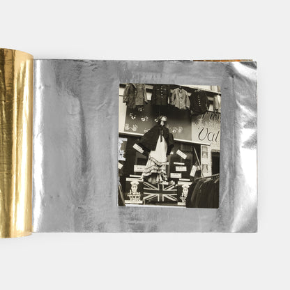 These photographs show the interior and exterior of the I Was Lord Kitchener's Valet boutique on Portobello Road and an anti-apartheid rally in November 1966.