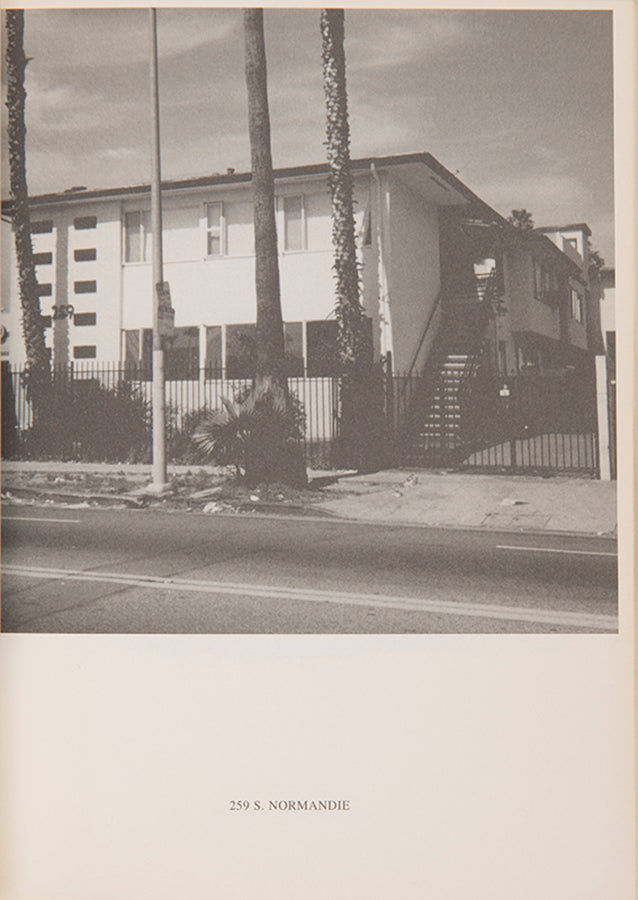 Ed Ruscha's 1965 book Some Los Angeles Apartments included a photograph of The Capri, a building at 118 N. Normandie. John O'Brian's book More Los Angeles Apartments follows Ruscha's format and contains photographs of other apartment buildings on the same stretch of road.