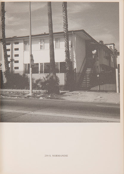 Ed Ruscha's 1965 book Some Los Angeles Apartments included a photograph of The Capri, a building at 118 N. Normandie. John O'Brian's book More Los Angeles Apartments follows Ruscha's format and contains photographs of other apartment buildings on the same stretch of road.