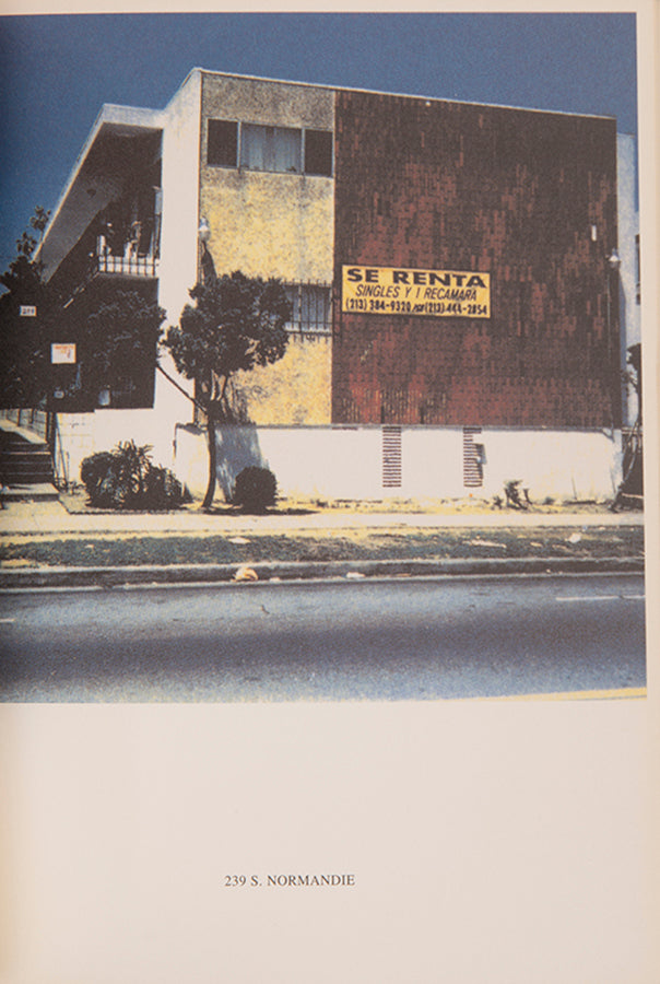 Ed Ruscha's 1965 book Some Los Angeles Apartments included a photograph of The Capri, a building at 118 N. Normandie. John O'Brian's book More Los Angeles Apartments follows Ruscha's format and contains photographs of other apartment buildings on the same stretch of road.