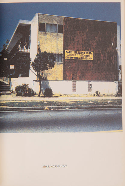 Ed Ruscha's 1965 book Some Los Angeles Apartments included a photograph of The Capri, a building at 118 N. Normandie. John O'Brian's book More Los Angeles Apartments follows Ruscha's format and contains photographs of other apartment buildings on the same stretch of road.