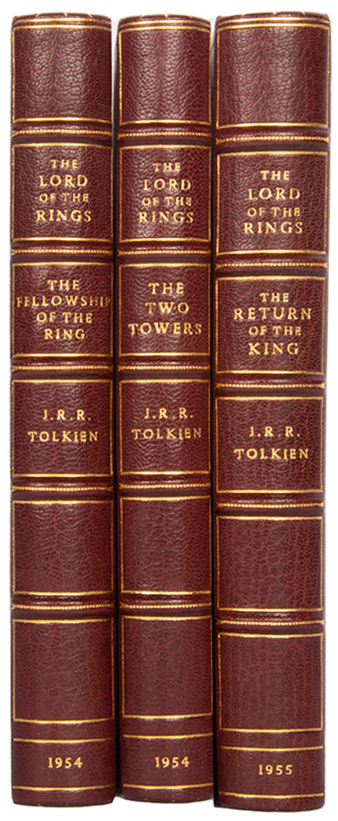 First editions of  the three volumes of The Lord of the Rings by J.R.R. Tolkien bound by Sangorski & Sutcliffe with the Eye of Sauron on the front board of each in gilt