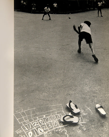 Someday, Somewhere contains photographs from Chicago and Tokyo, clearly showing the influence of Ishimoto's time studying with Harry Callahan and Aaron Siskind.