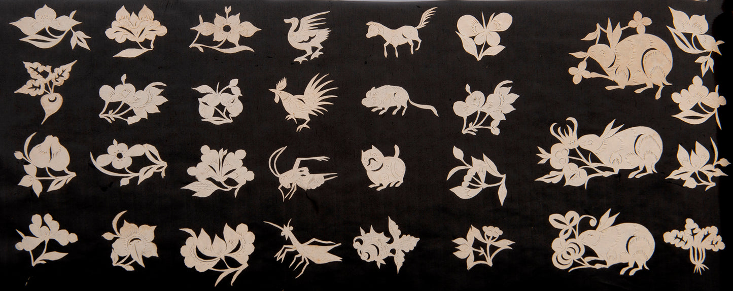 An exceptional album containing hundreds of delicate and elaborate Chinese jianzhi paper cut-outs.