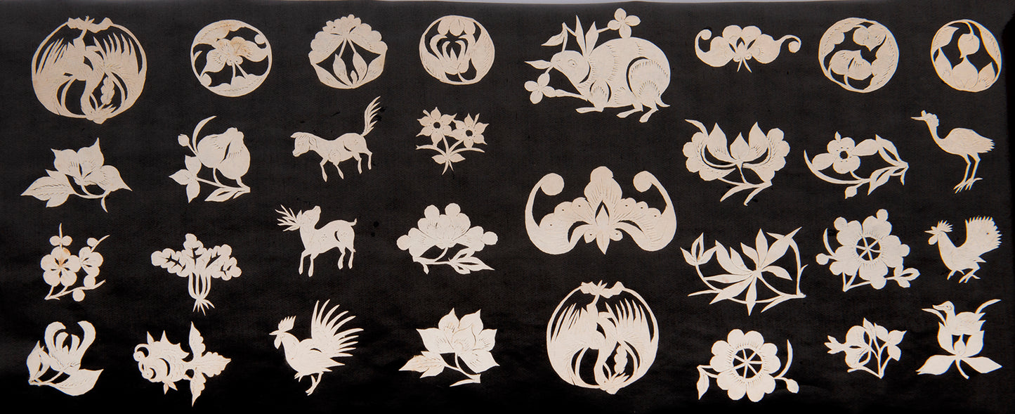 Album of 19th-century Chinese jianzhi paper cut-outs.