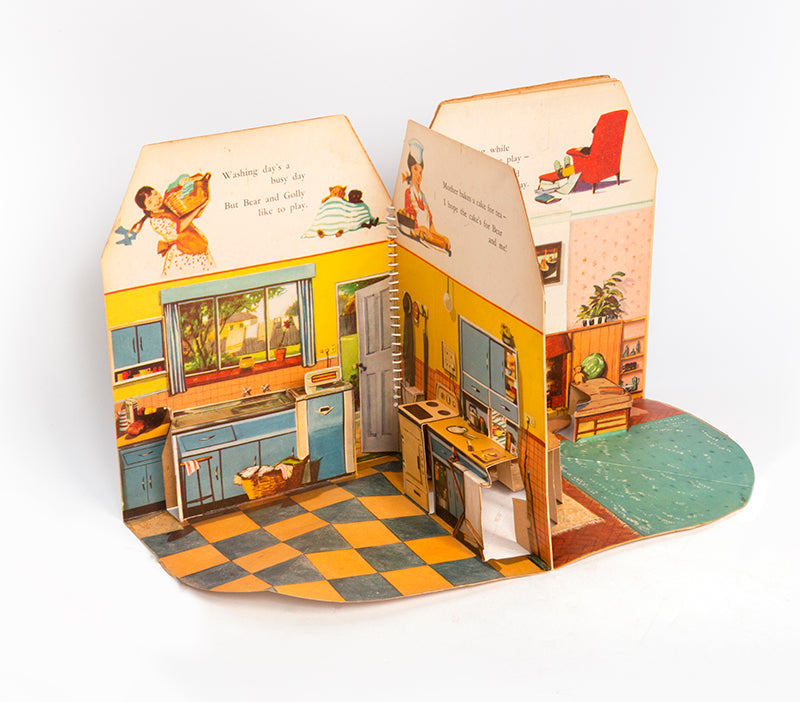 A charming pop-up book, extremely well-preserved, which fold out 360 degrees to create a functioning open walled doll house, containing 4 rooms: a living room, kitchen, bathroom and bedroom. 