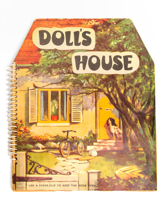 A charming pop-up book, extremely well-preserved, which fold out 360 degrees to create a functioning open walled doll house, containing 4 rooms: a living room, kitchen, bathroom and bedroom.