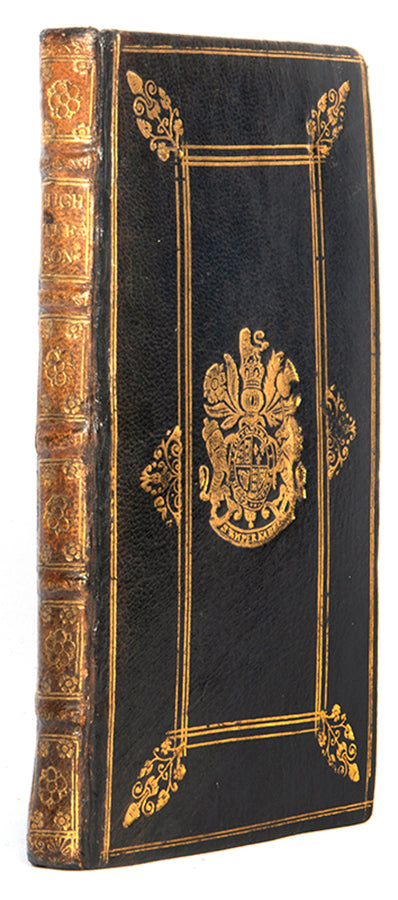 The first edition of this collection of statutes relating to High Treason, in a contemporary black morocco binding emblazoned with the arms of Queen Anne in gilt to both covers