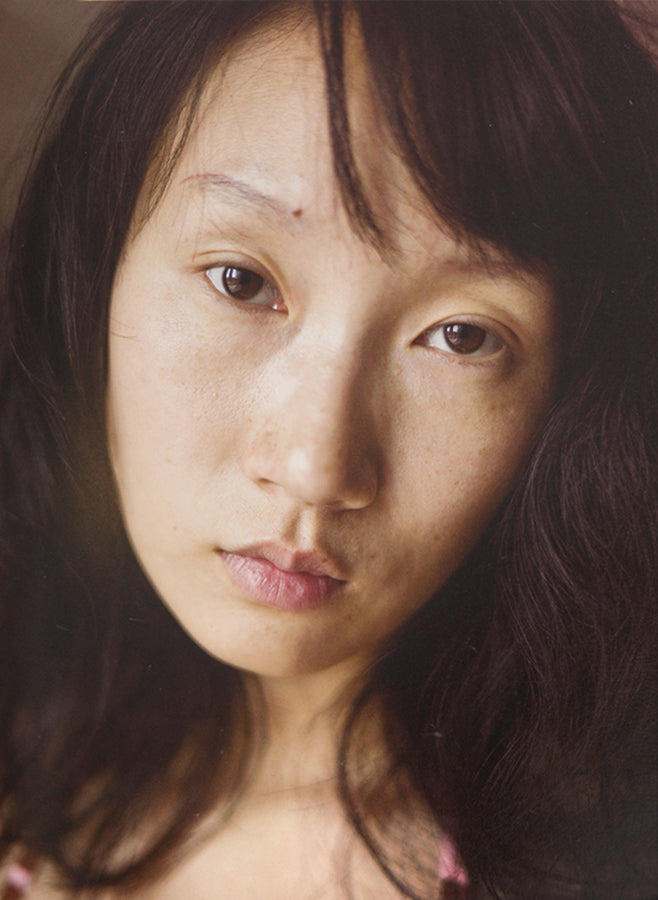 This Face contains 500 photographs by Xu Yong of Zi U, a Chinese sex worker in Beijing.