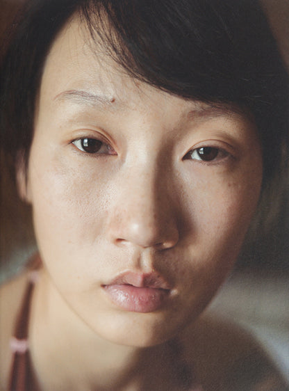 This Face contains 500 photographs by Xu Yong of Zi U, a Chinese sex worker in Beijing.