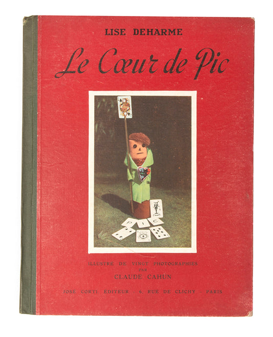 Lise Deharme and Claude Cahun envisioned Le Coeur de Pic as a cohesive artwork. Cahun's photographs brought inanimate objects to life and encouraged older viewers to see the world through a child's perspective.