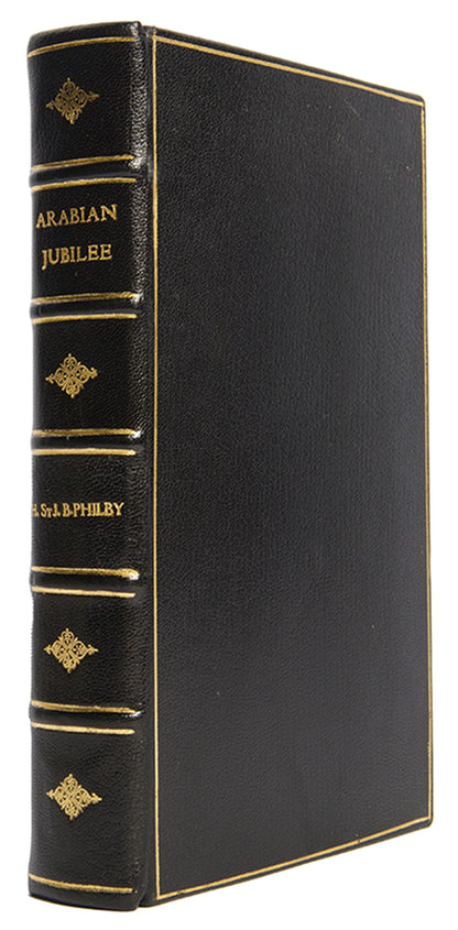 Finely bound first edition of Harry St. John Philby's Arabian Jubilee, the first full-length biography of King Saud.