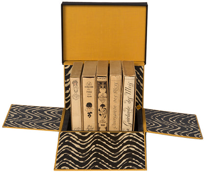 A fine, complete set of La Guirlande des Mois by George Barbier which, although published in a small format due to wartime austerity, is nevertheless extremely luxurious