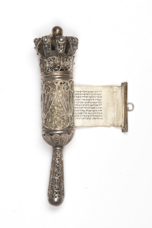 A beautiful example of a small Bezalel Megillat Esther on vellum, housed in a silver case with elaborate filigree and semiprecious stones.