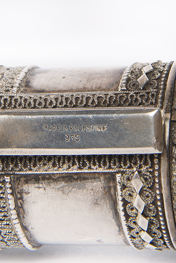A beautiful example of a Bezalel Megillat Esther on vellum, housed in a silver case with elaborate filigree and semiprecious stones.
