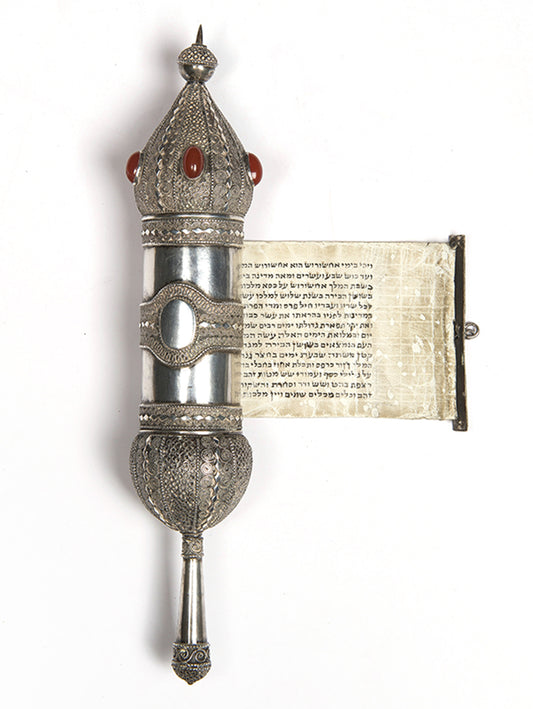 A beautiful example of a Bezalel Megillat Esther on vellum, housed in a silver case with elaborate filigree and semiprecious stones.