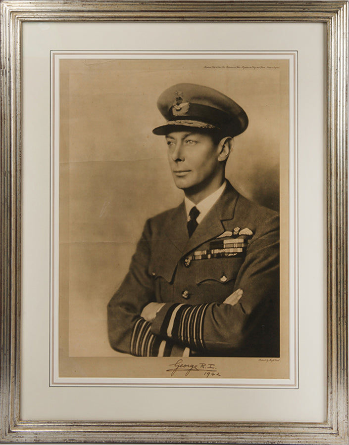 Black & white photographic prints of King George VI by Hugh Cecil, signed and dated by the King, the other of Queen Elizabeth by Dorothy Wilding, also signed and dated