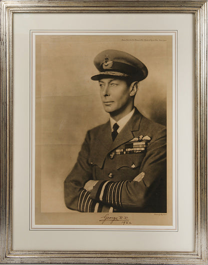 Black & white photographic prints of King George VI by Hugh Cecil, signed and dated by the King, the other of Queen Elizabeth by Dorothy Wilding, also signed and dated