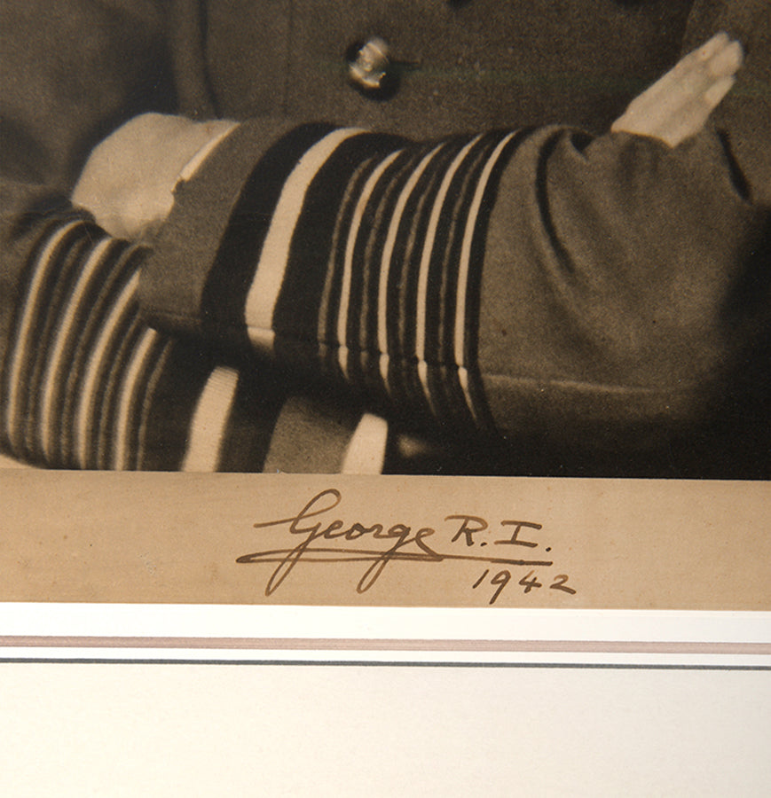 Black & white photographic prints of King George VI by Hugh Cecil, signed and dated by the King, the other of Queen Elizabeth by Dorothy Wilding, also signed and dated