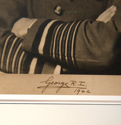 Black & white photographic prints of King George VI by Hugh Cecil, signed and dated by the King, the other of Queen Elizabeth by Dorothy Wilding, also signed and dated
