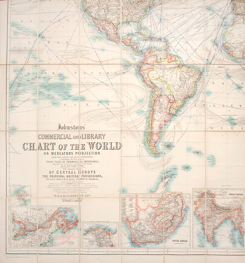 The turn of the century issue of W. & A.K. Johnston's Commercial and Library Chart of the World, an impressive world map focused on trading routes.