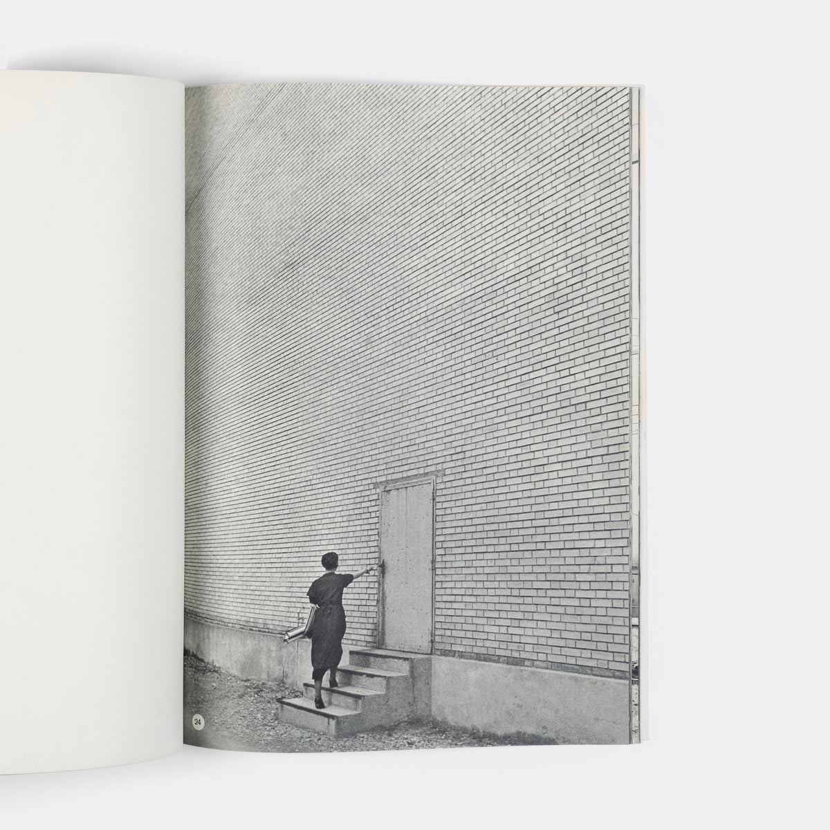 This company book includes Jakob Tuggener's photographs of the machinery in Maschinenfabrik Oerlikon's workshops and the men and women who operate it.