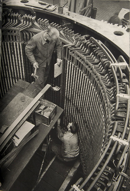 This company book includes Jakob Tuggener's photographs of the machinery in Maschinenfabrik Oerlikon's workshops and the men and women who operate it.