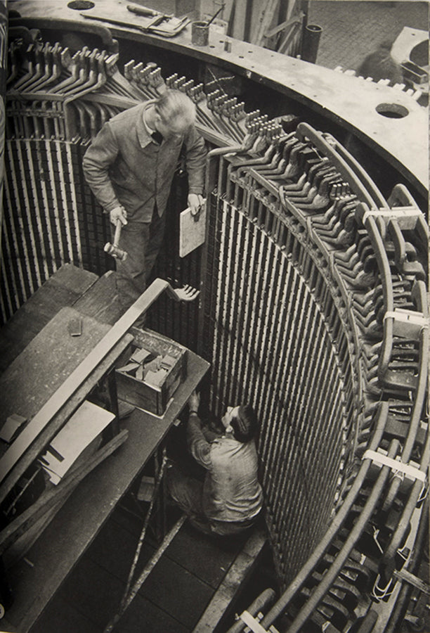 This company book includes Jakob Tuggener's photographs of the machinery in Maschinenfabrik Oerlikon's workshops and the men and women who operate it.