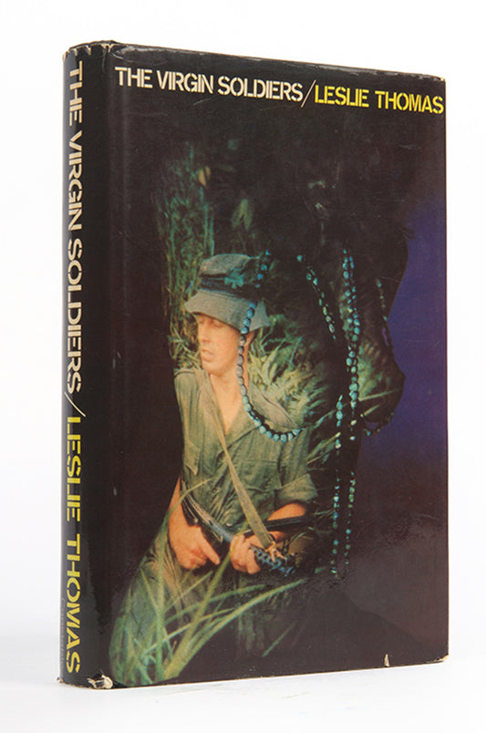 A first edition of Thomas' immensely popular, darkly comic story of British conscripts in the Cold War.