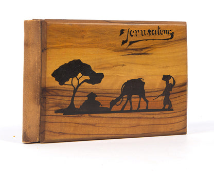 Early 20th-century souvenirs from Jerusalem, containing local dried flowers and colour-lithograthed views of the Holy Land.