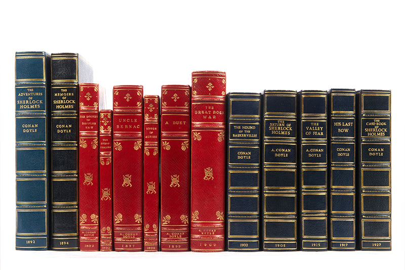 A fine collection of 13 first edition titles by Arthur Conan Doyle, including 7 Sherlock Holmes books, bound in full blue morocco and half red morocco gilt
