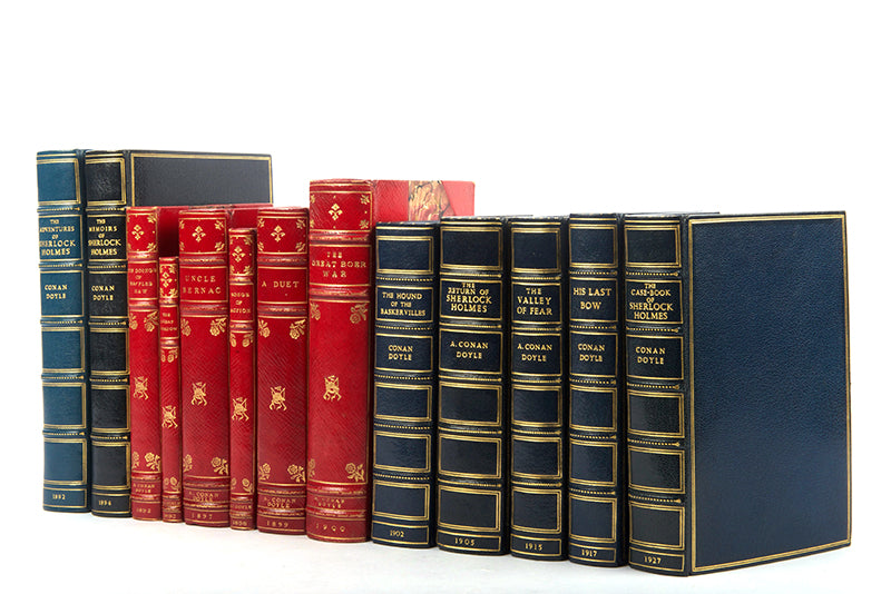 A fine collection of 13 first edition titles by Arthur Conan Doyle, including 7 Sherlock Holmes books, bound in full blue morocco and half red morocco gilt