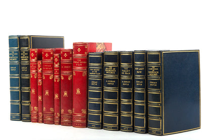 A fine collection of 13 first edition titles by Arthur Conan Doyle, including 7 Sherlock Holmes books, bound in full blue morocco and half red morocco gilt