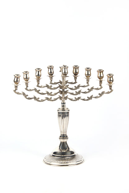 A magnificent example of a fine, early-20th-century British, silver Hanukkah lamp with a detachable Shamash by Sigmund Zyto.