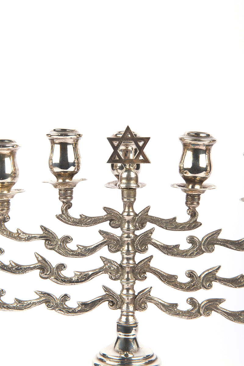 A magnificent example of a fine, early-20th-century British, silver Hanukkah lamp with a detachable Shamash by Sigmund Zyto.