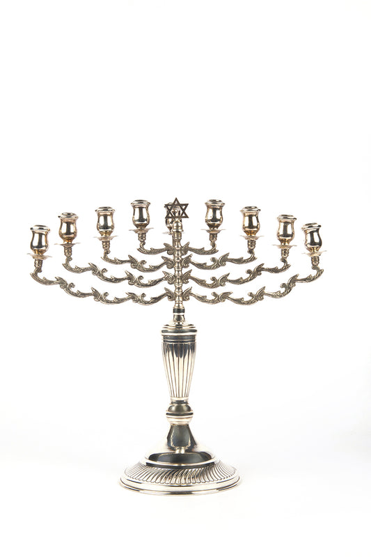 A magnificent example of a fine, early-20th-century British, silver Hanukkah lamp with a detachable Shamash by Sigmund Zyto.