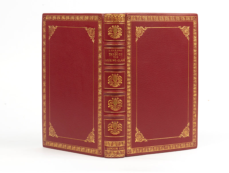 A handsomely bound edition of Through the looking glass, by Lewis Carroll, in red leather and gilt, First edition, second issue, 1872, thirteenth thousand