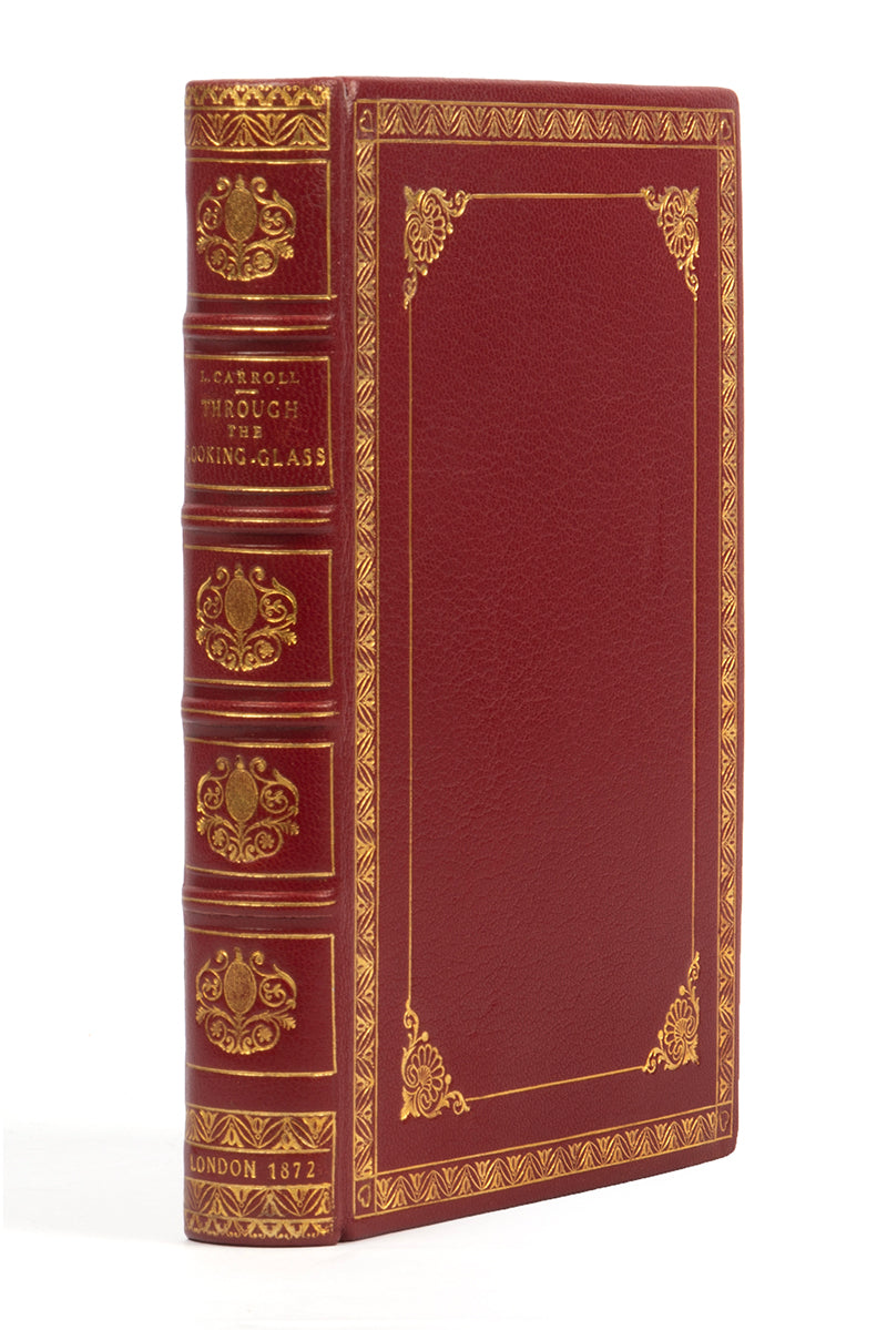 A handsomely bound edition of Through the looking glass, by Lewis Carroll, in red leather and gilt, First edition, second issue, 1872, thirteenth thousand