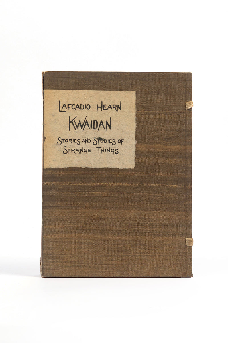 Lovely copy of Hearn's Kwaidan, housed in a green silk box, richly bound in green brocade, featuring illustrations by the artist, two printed from woodblock