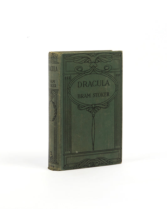 An early edition of Bram Stoker's genre-defininf vampire novel Dracula, in the original publisher's cloth