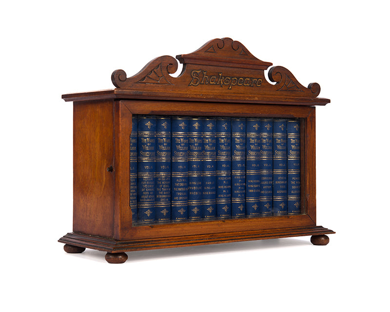 A charming pocket book set of Shakespeare's complete works, housed in the original glazed wooden cabinet.