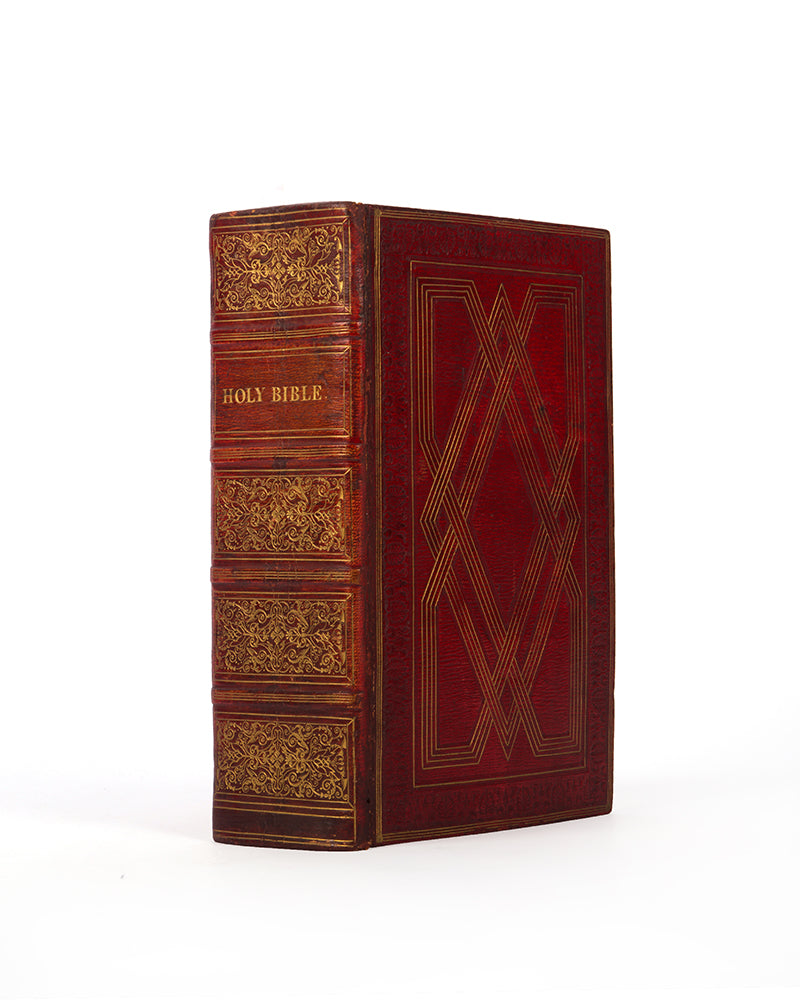 An excellent example of this family Bible bound contemporary red morocco tooled with a gilt strapwork design