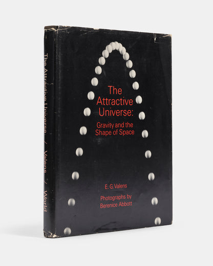 First edition of The Attractive Universe by E.G Valens, a delightful introductory work on gravity with superb illustrations by modernsit photographer Berenice Abbott.