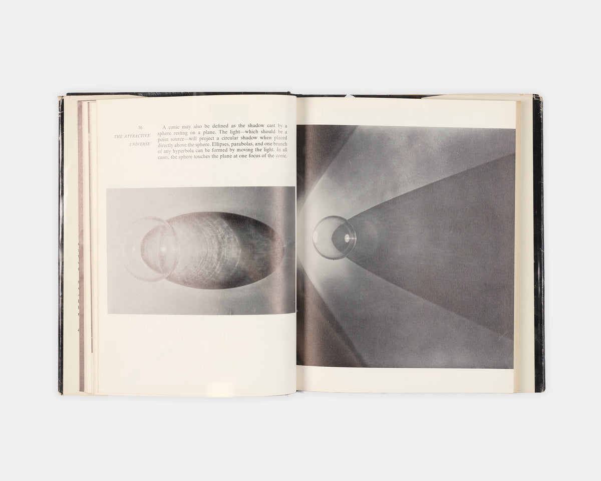 First edition of The Attractive Universe by E.G Valens, a delightful introductory work on gravity with superb illustrations by modernsit photographer Berenice Abbott.