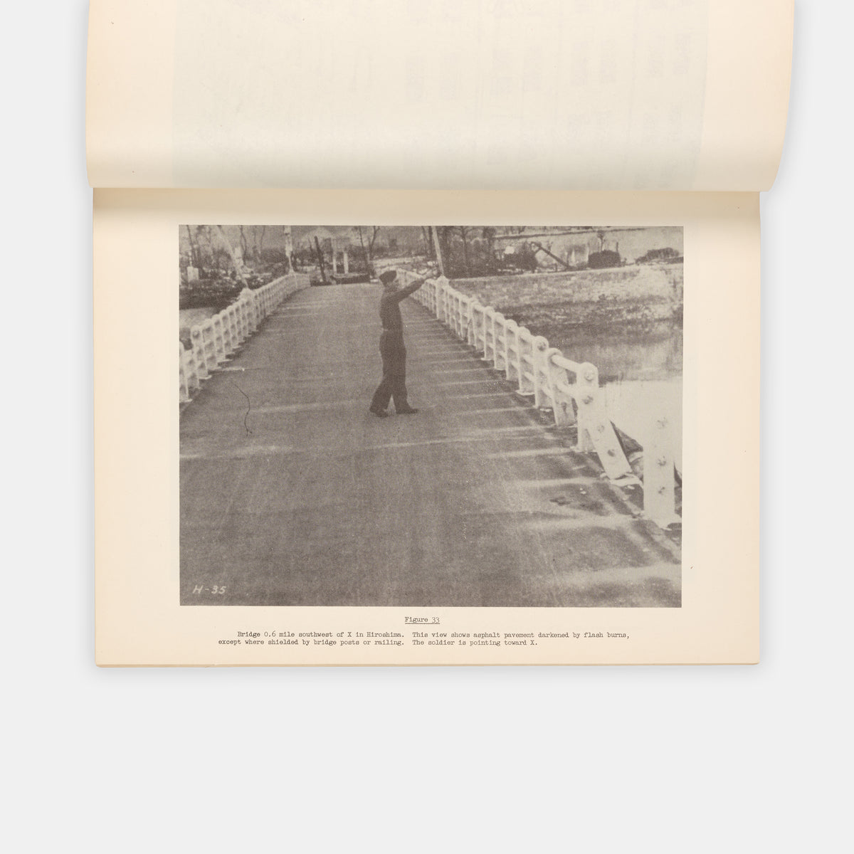 First edition, the complete set with both text and photo volumes, of this important, early scientific report on the atomic bombings of Hiroshima and Nagasaki by representatives f the Manhattan Project.