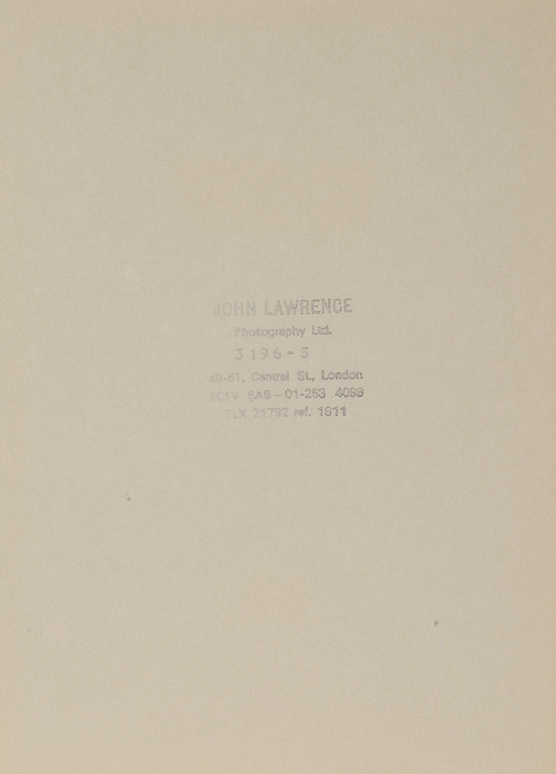 Two signed three-quater length photographic portraits by John Lawrence of HM Queen Elizabeth II and Prince Philip, dated 1986 in original frames by Longmire