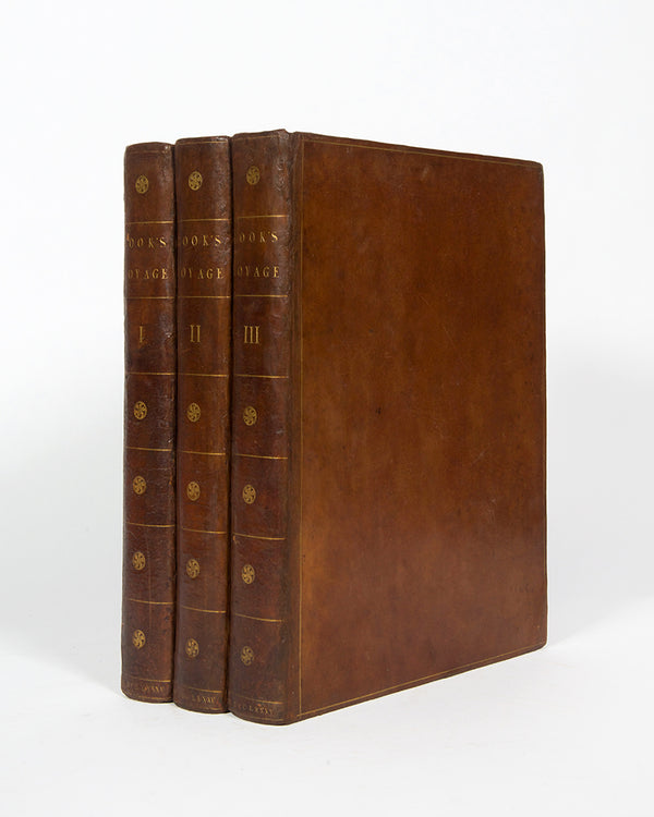 Cook's third voyage, A Voyage to the Pacific Ocean, with the atlas and 63 engravings and charts, one of the most important English books published in the last quarter of the eighteenth century.