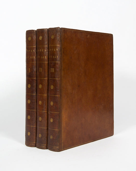 Cook's third voyage, A Voyage to the Pacific Ocean, with the atlas and 63 engravings and charts, one of the most important English books published in the last quarter of the eighteenth century.